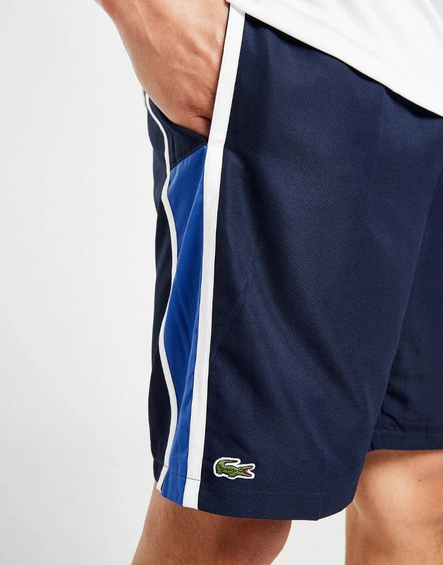 Product Lacoste calções footing 

