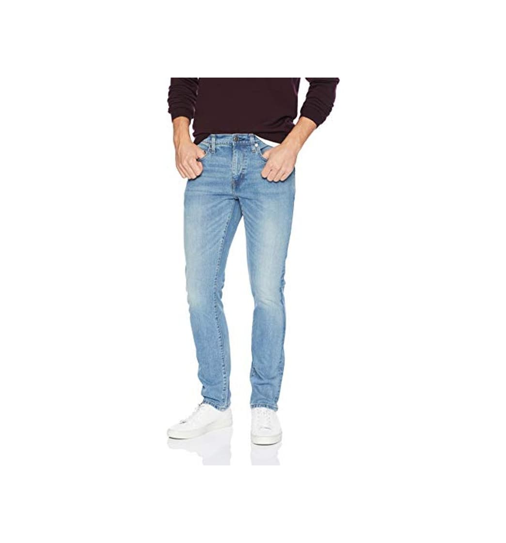 Moda Amazon Essentials - Jean elástico ajustado para hombre, Azul